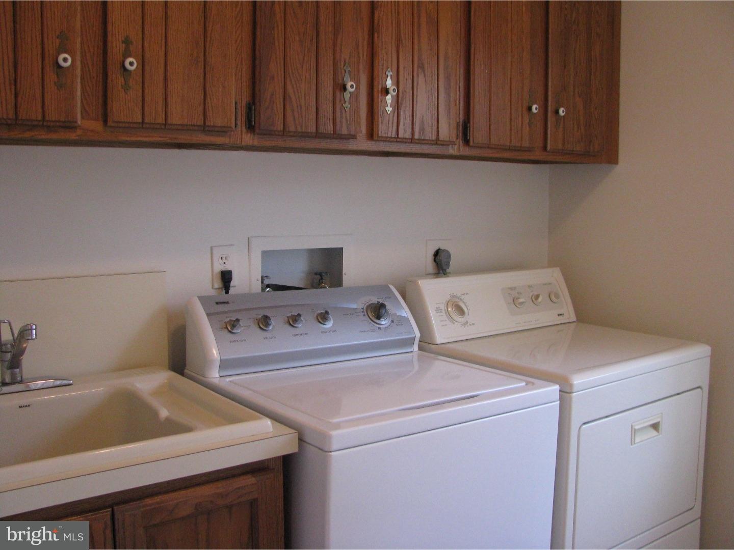 11 Raphael Road Hockessin, DE 19707 - Photo 14 of 25 a utility room with dryer and washer