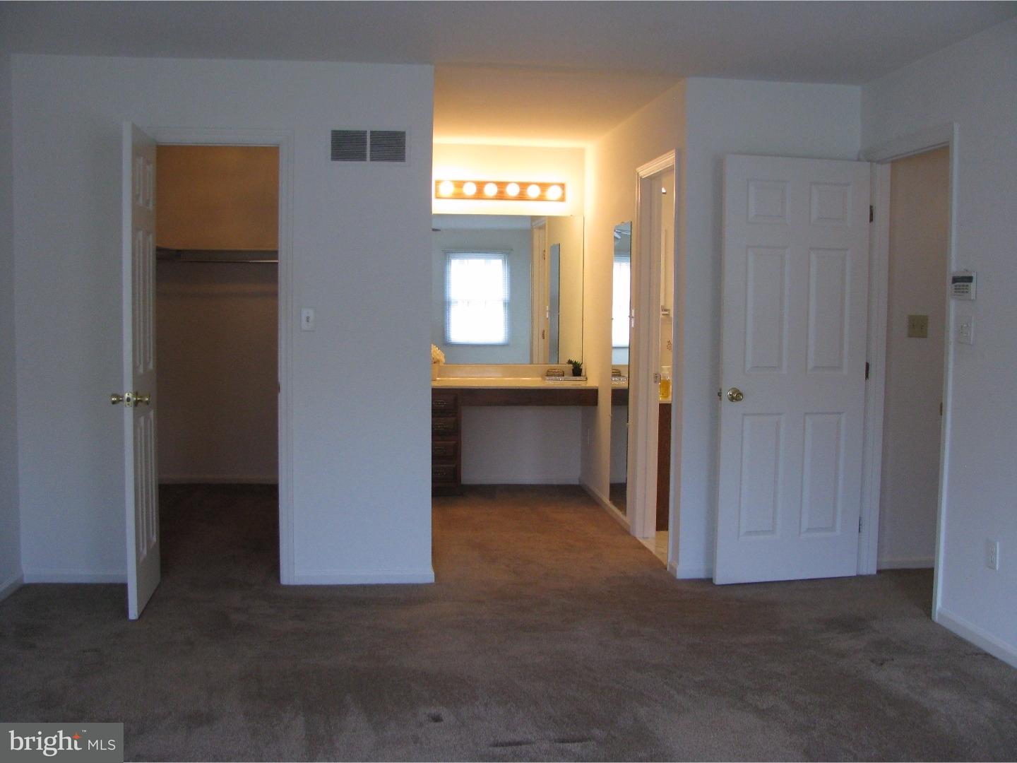 11 Raphael Road Hockessin, DE 19707 - Photo 15 of 25 an empty room with a window and a hallway