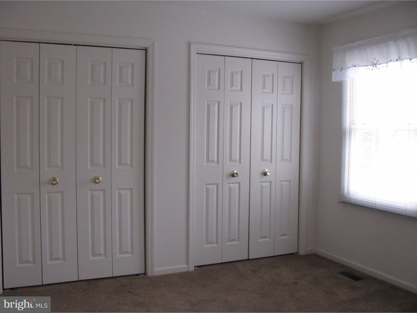 11 Raphael Road Hockessin, DE 19707 - Photo 17 of 25 a view of an empty room with a window