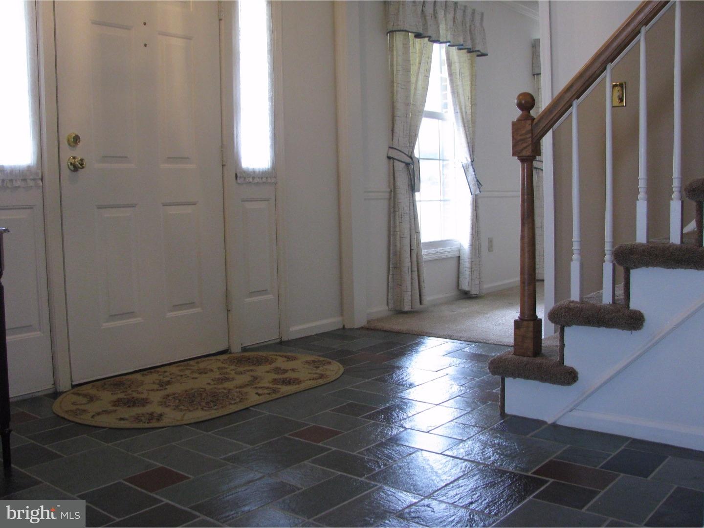 11 Raphael Road Hockessin, DE 19707 - Photo 3 of 25 a view of a livingroom with wooden floor