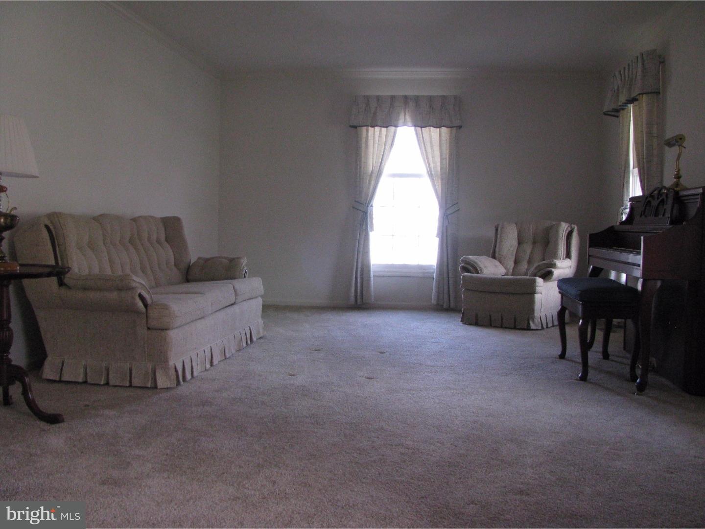 11 Raphael Road Hockessin, DE 19707 - Photo 4 of 25 a living room with furniture and a window