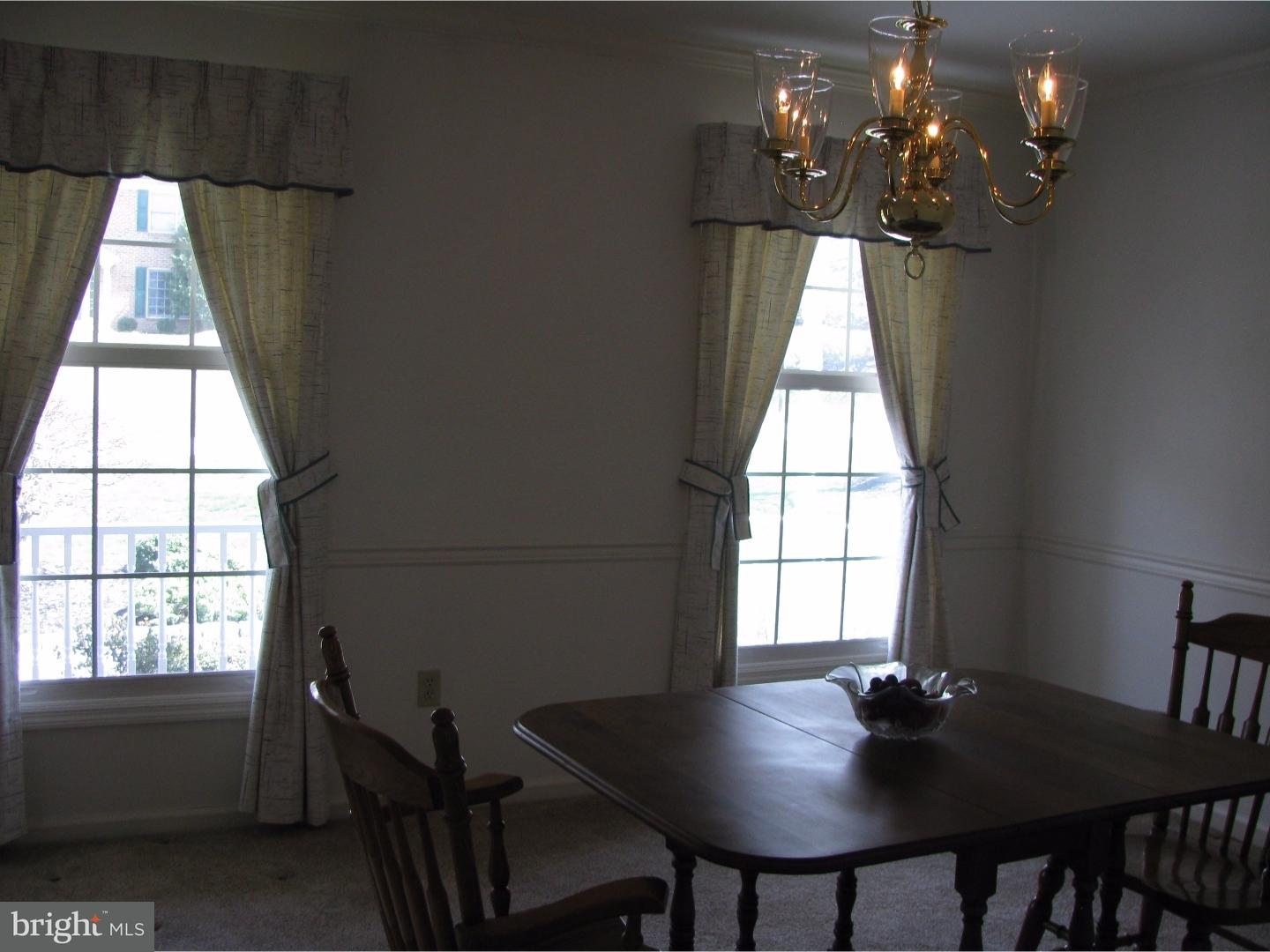 11 Raphael Road Hockessin, DE 19707 - Photo 5 of 25 a view of a dining room with furniture and window