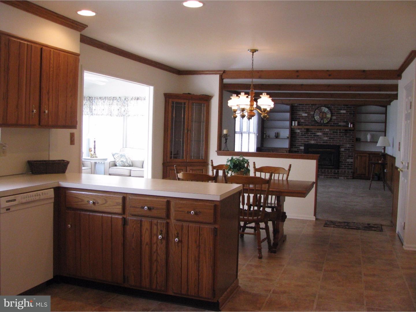 11 Raphael Road Hockessin, DE 19707 - Photo 9 of 25 a kitchen with a table chairs and a window