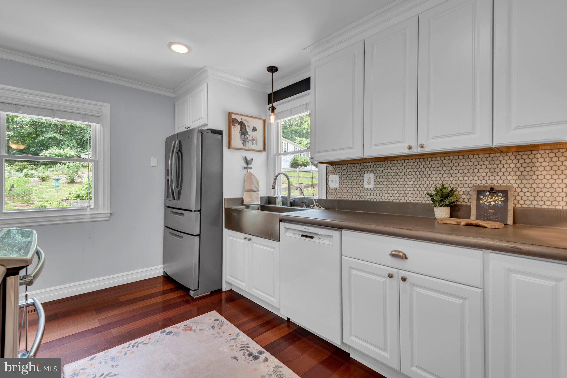 955 Hilltop Road Arnold, MD 21012 - Photo 15 of 56 Sleek Stainless Appliances/Mosaic Tile Backsplash