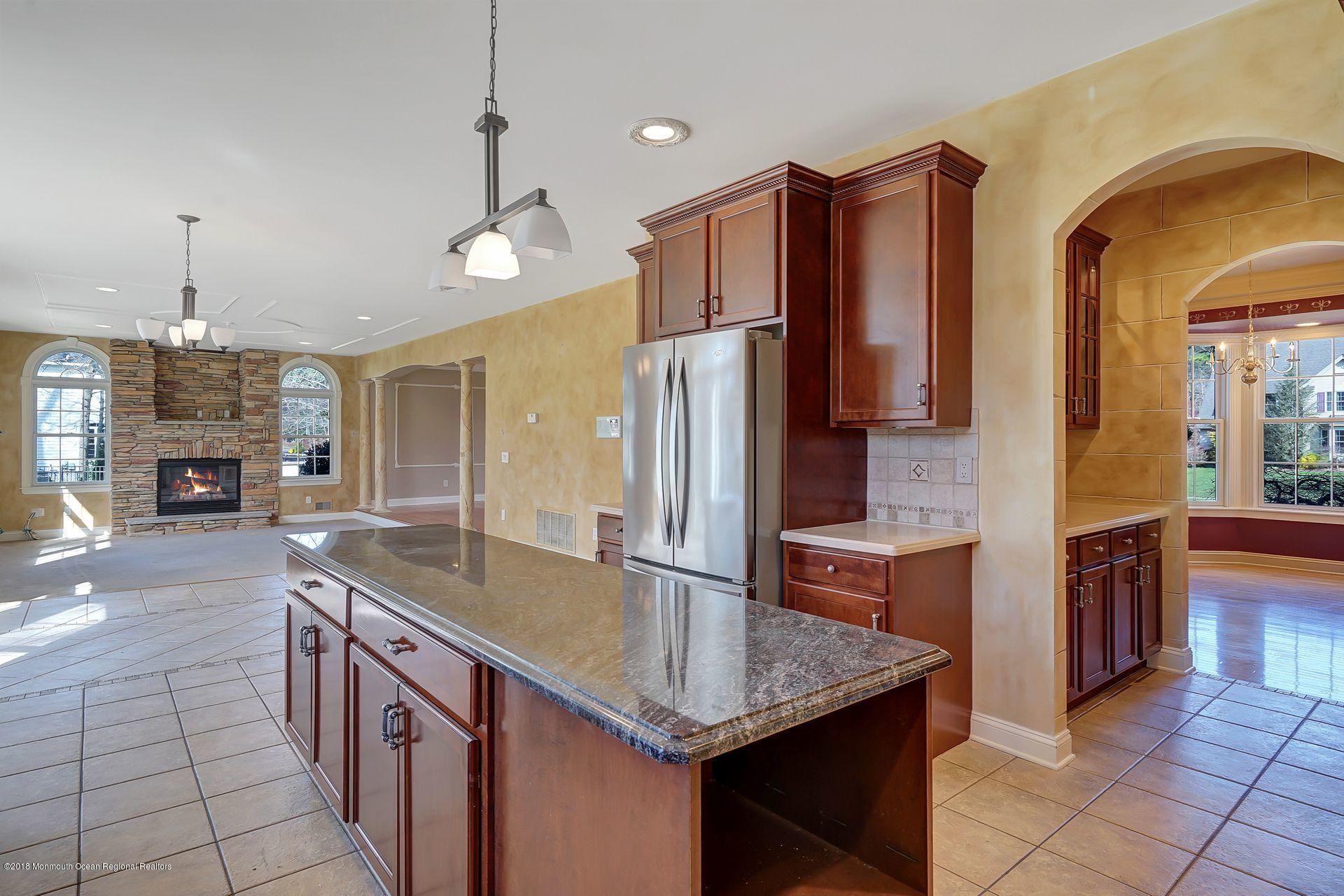 26 Conor Road Jackson, NJ 08527 - Photo 23 of 60 a kitchen with stainless steel appliances granite countertop a sink refrigerator and cabinets