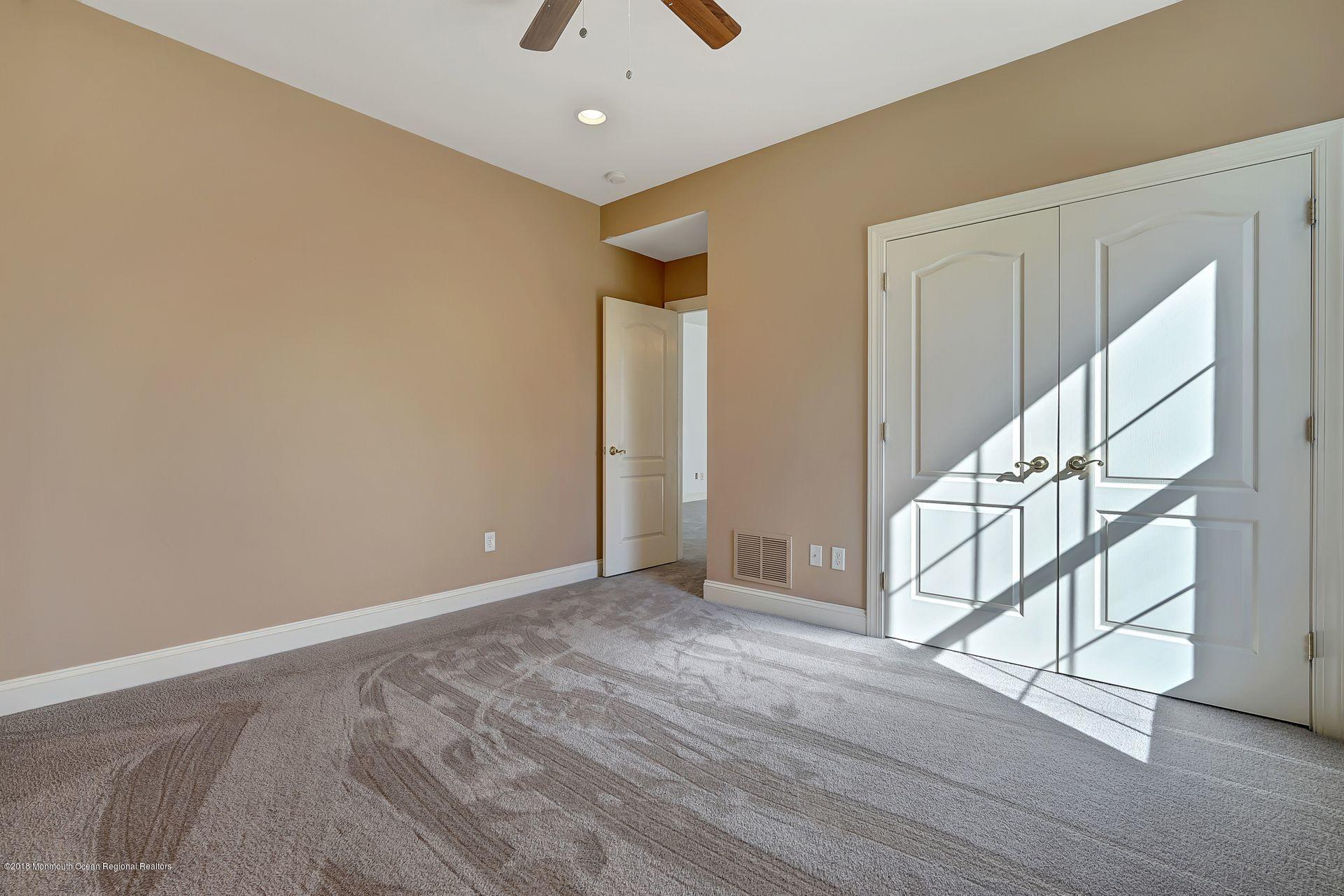 26 Conor Road Jackson, NJ 08527 - Photo 33 of 60 a view of an empty room with stairs