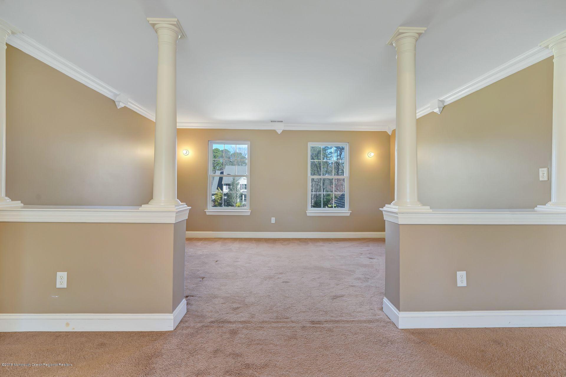 26 Conor Road Jackson, NJ 08527 - Photo 46 of 60 a view of an empty room with window and mirror