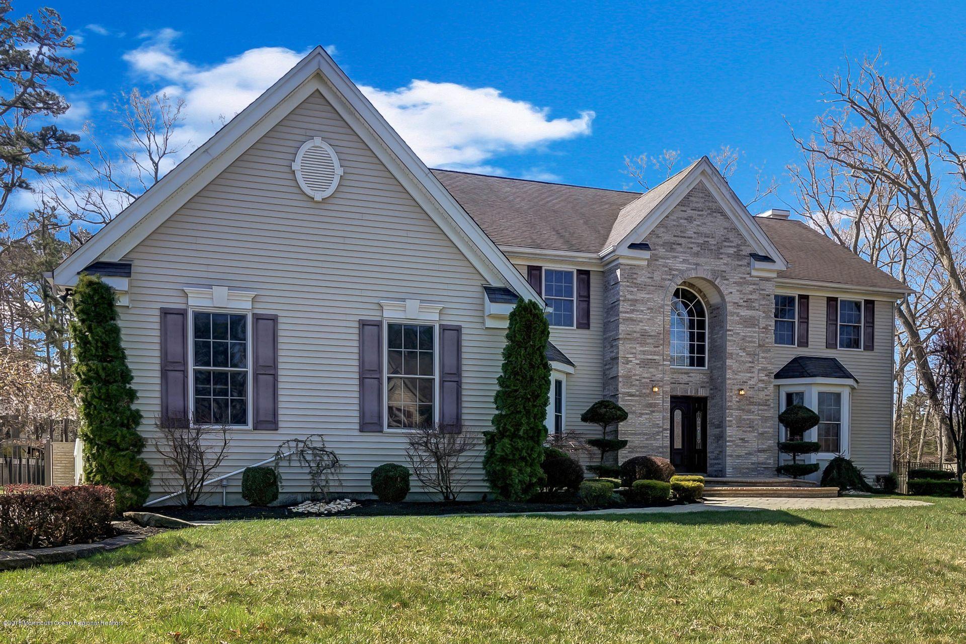 26 Conor Road Jackson, NJ 08527 - Photo 5 of 60 a front view of a house with a yard
