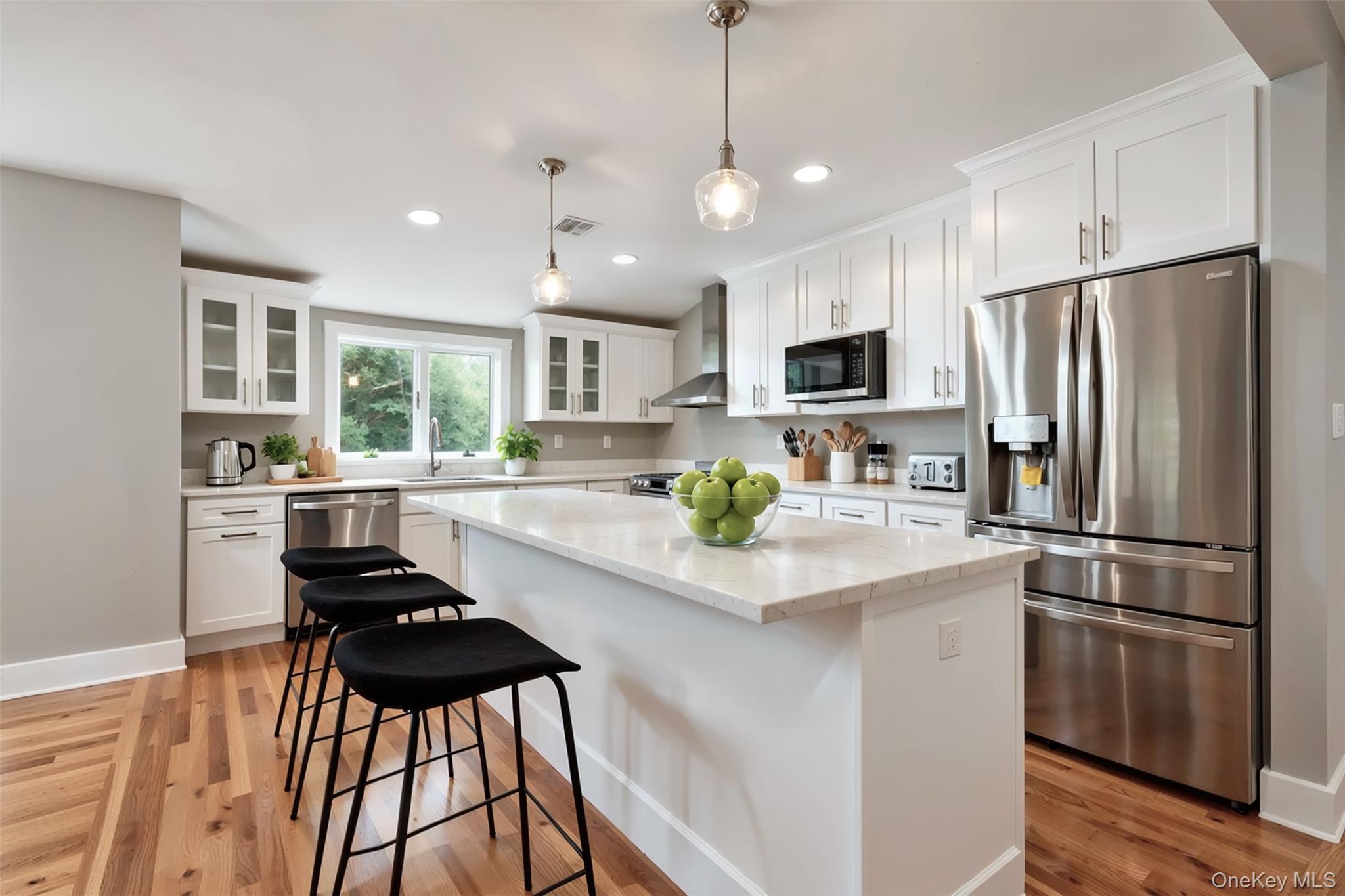 142 Crooked Hill Road Huntington Station, NY 11746 - Photo 2 of 18 Kitchen with stainless steel appliances, a kitchen island, white cabinets, light stone counters, and recessed lighting