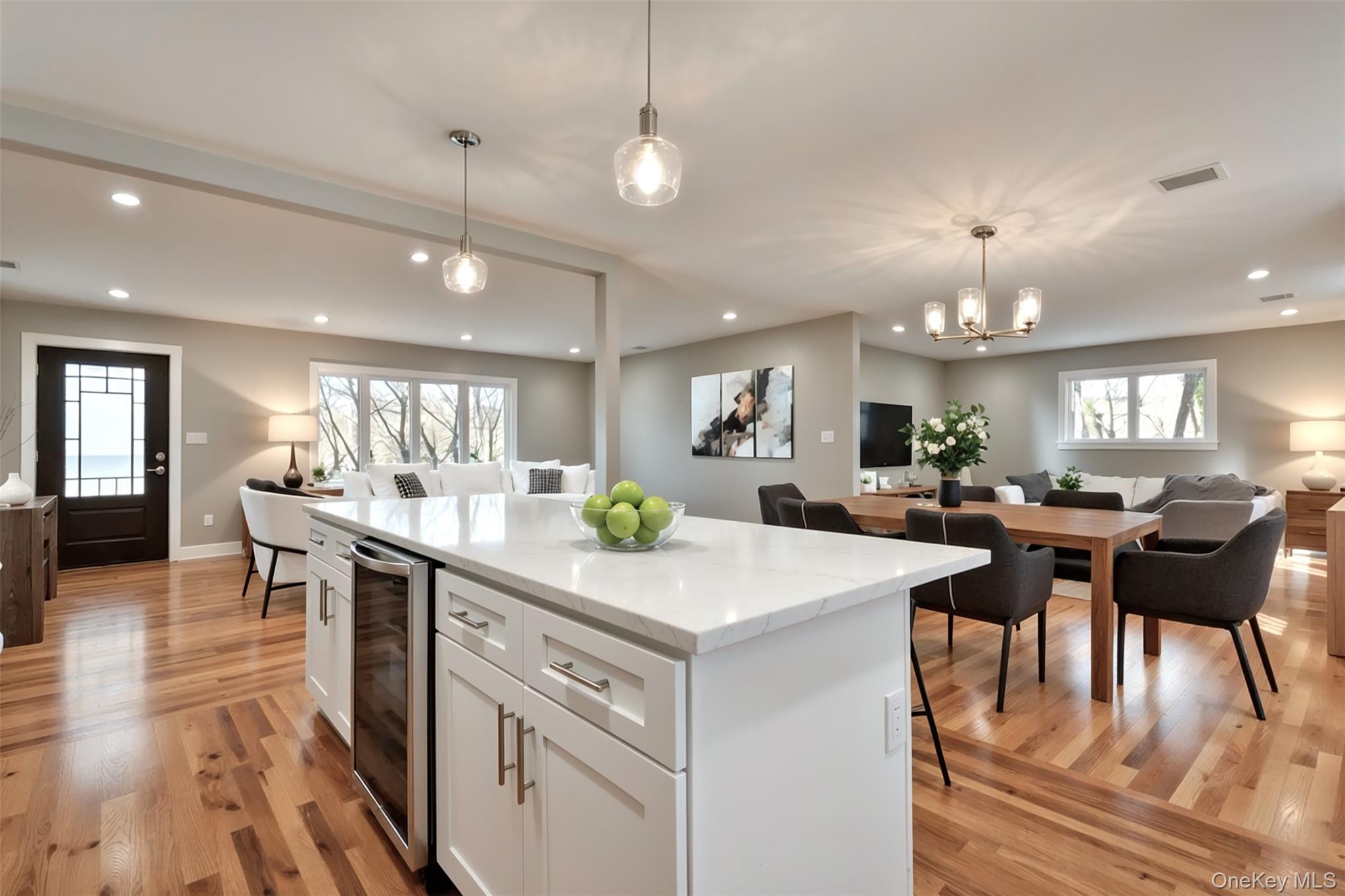 142 Crooked Hill Road Huntington Station, NY 11746 - Photo 18 of 18 Kitchen featuring open floor plan, a center island, beverage cooler, white cabinetry, and healthy amount of natural light
