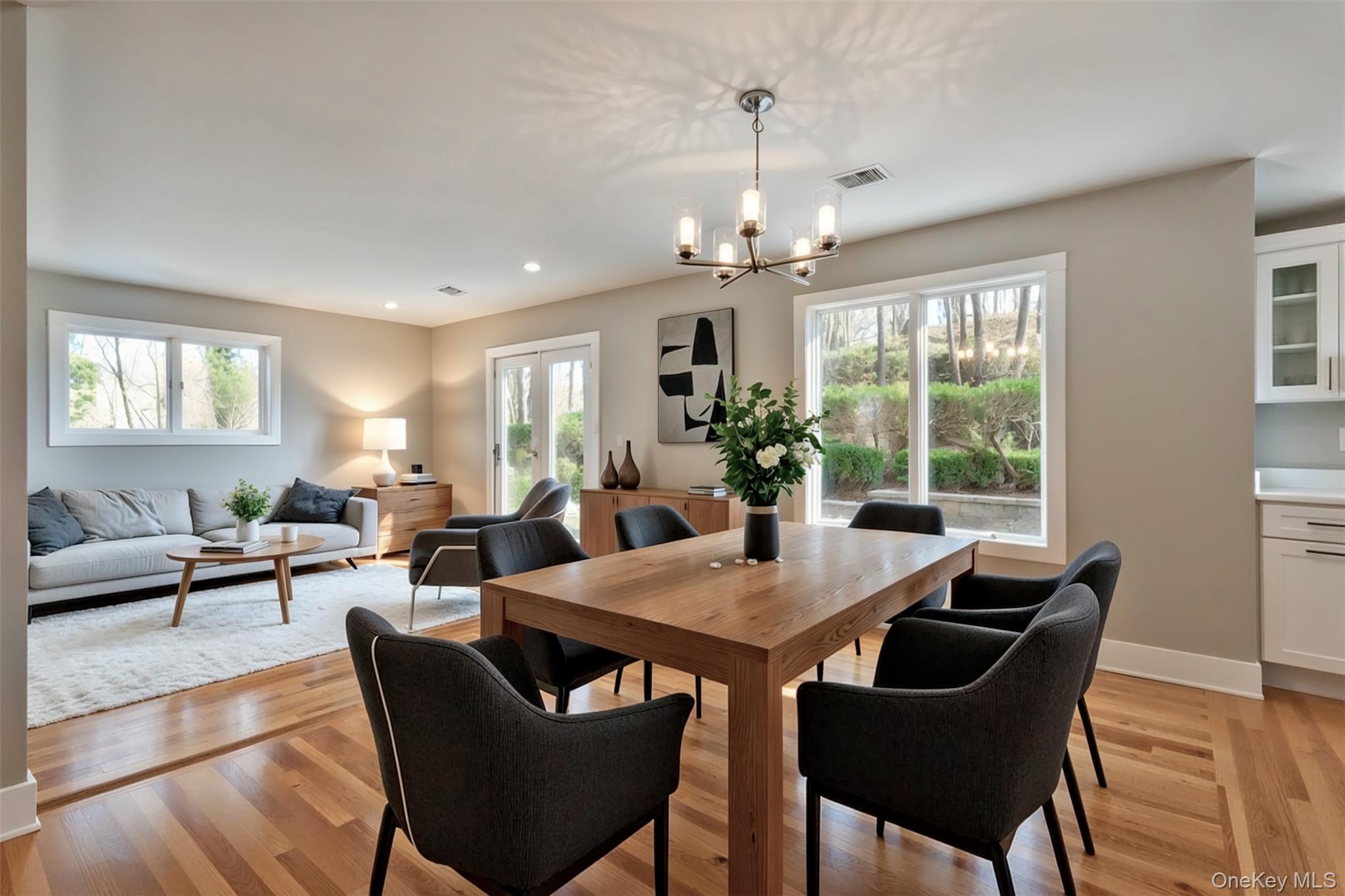 142 Crooked Hill Road Huntington Station, NY 11746 - Photo 4 of 18 Dining area featuring light wood-style flooring, plenty of natural light, a chandelier, and recessed lighting