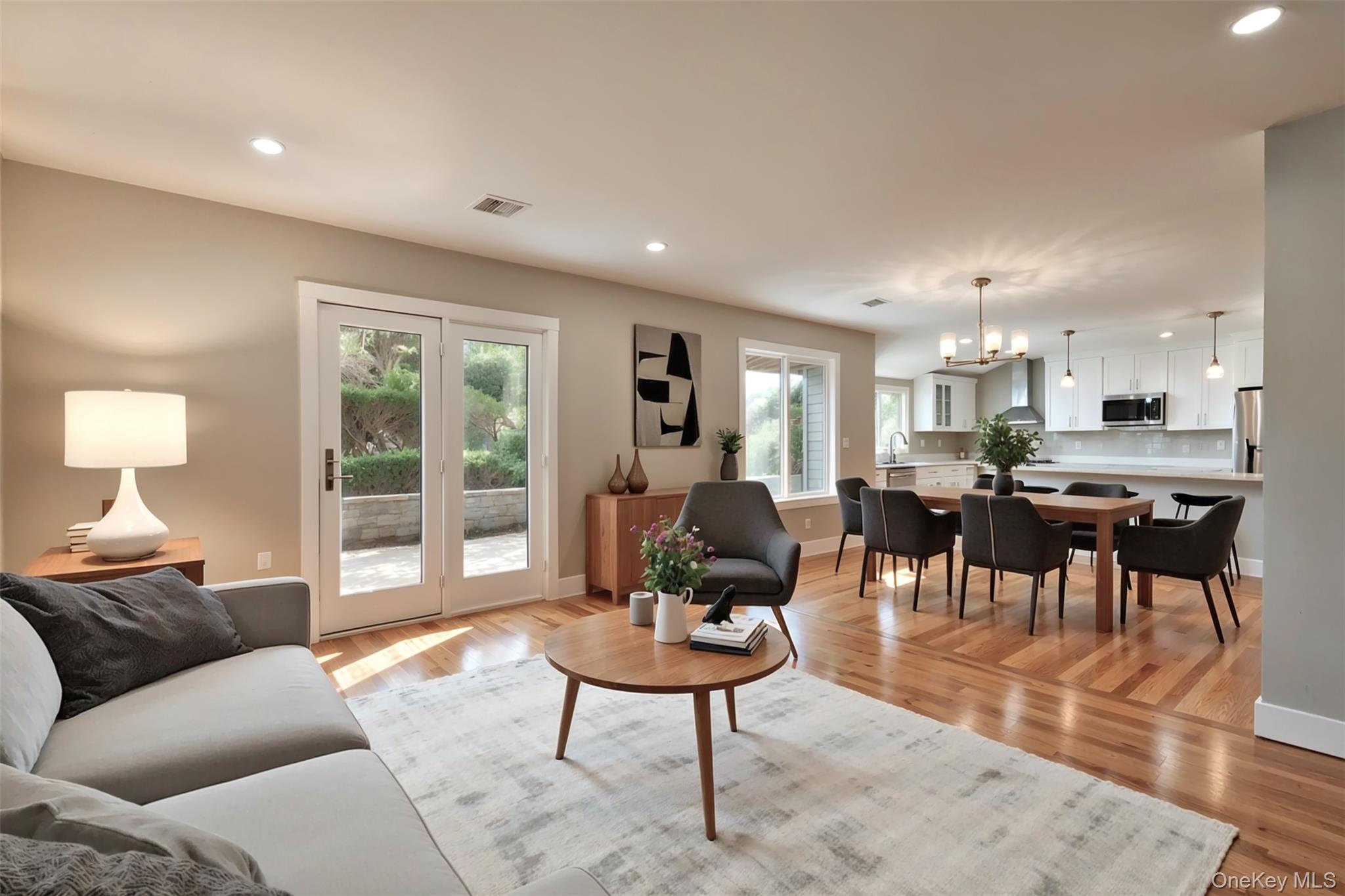 142 Crooked Hill Road Huntington Station, NY 11746 - Photo 7 of 18 Living room featuring recessed lighting, a chandelier, and light wood finished floors