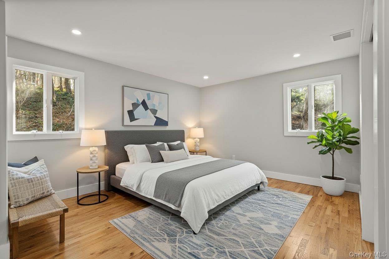 142 Crooked Hill Road Huntington Station, NY 11746 - Photo 8 of 18 Bedroom with light wood-type flooring and recessed lighting