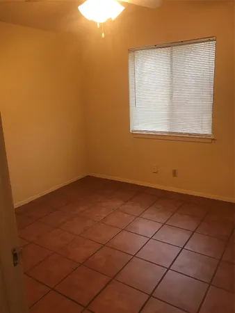 a view of a room that has a window in it