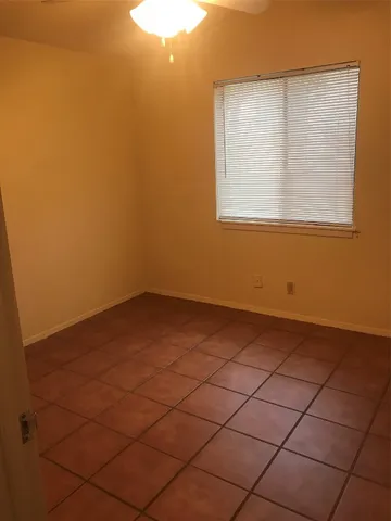 a view of a room that has a window in it