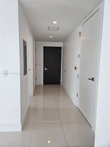 a spacious bathroom with a glass door shower