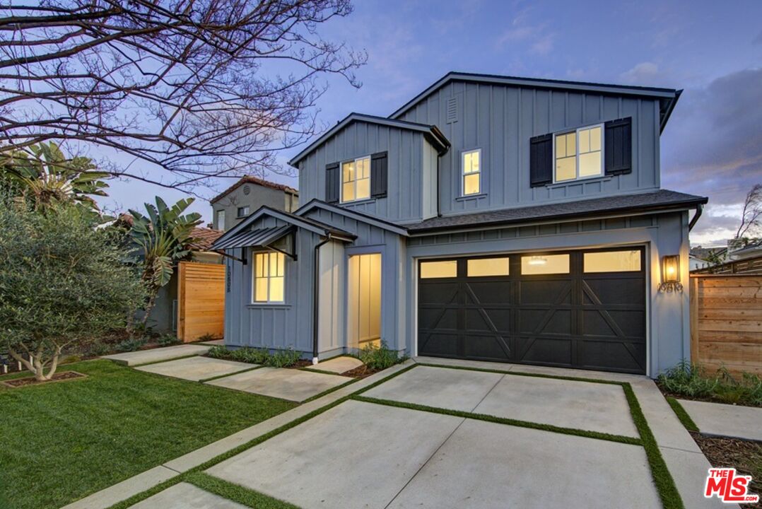 10810 Valley Spring Lane Studio City, CA 91602 - Photo 2 of 36 a front view of a house with a yard