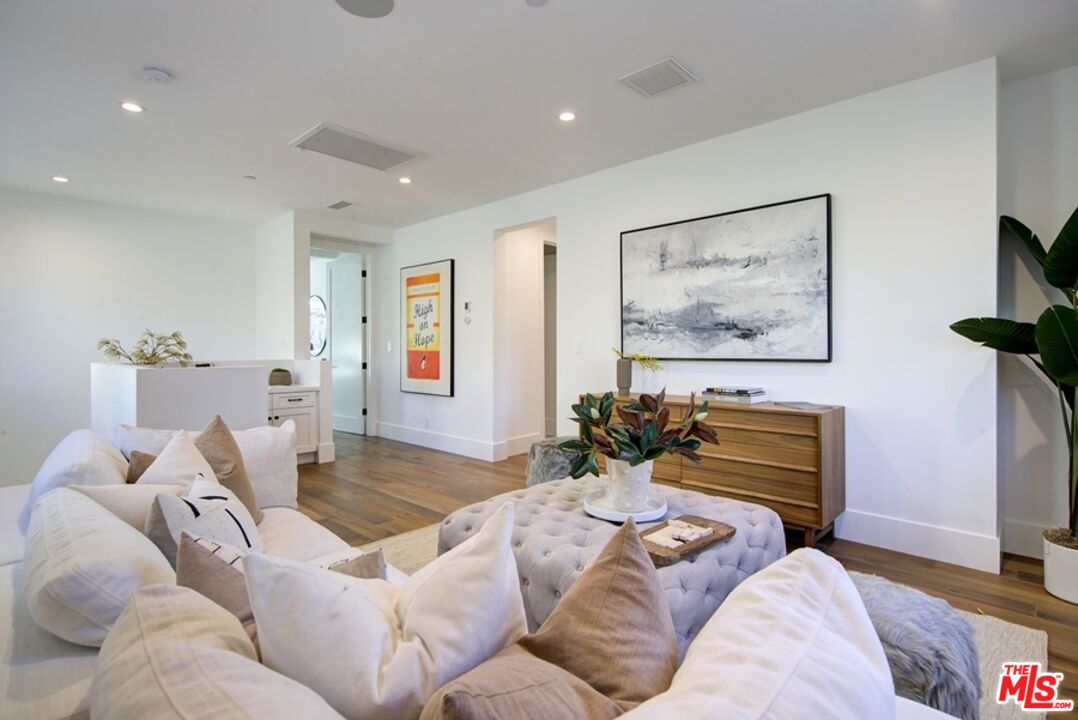 10810 Valley Spring Lane Studio City, CA 91602 - Photo 21 of 36 a living room with furniture and a flat screen tv