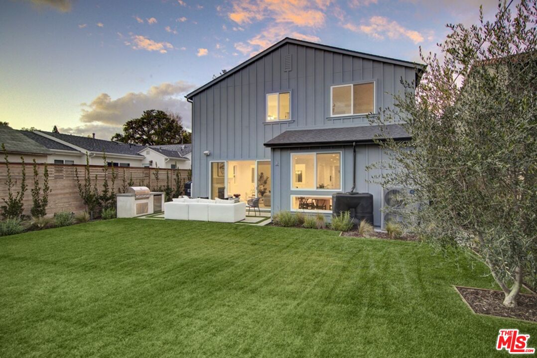 10810 Valley Spring Lane Studio City, CA 91602 - Photo 36 of 36 a front view of a house with a yard