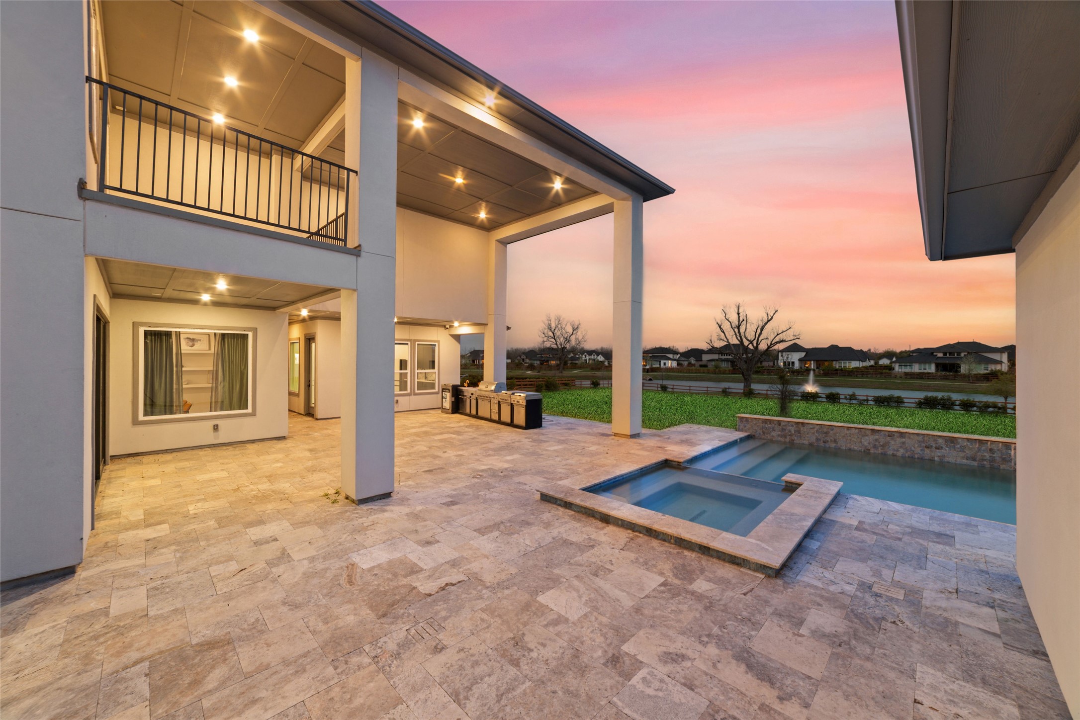 29627 Cir S Rnch Trail Fulshear, TX 77406 - Photo 46 of 50 Every room was designed to embrace the backyard, creating a seamless connection between indoor living and the resort-style spaces just beyond the glass.