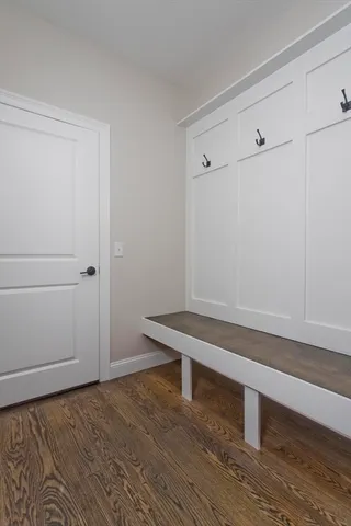 a room with a bench and vanity