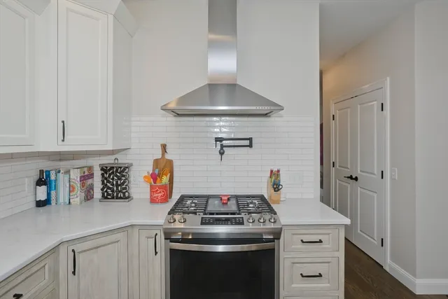 a kitchen with a stove and cabinets