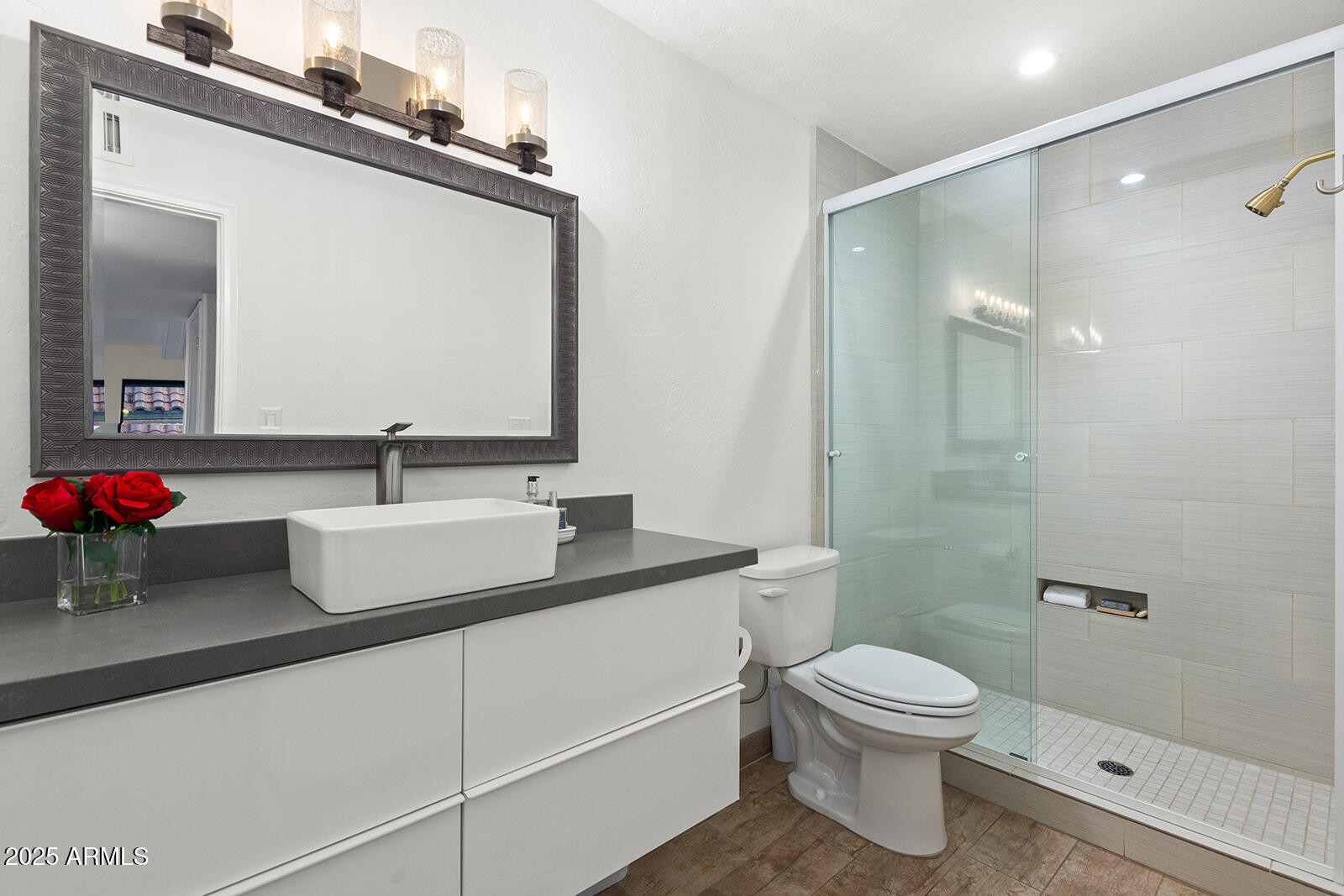 5822 North Scottsdale Road Paradise Valley, AZ 85253 - Photo 21 of 32 a bathroom with a granite countertop sink a toilet and a mirror