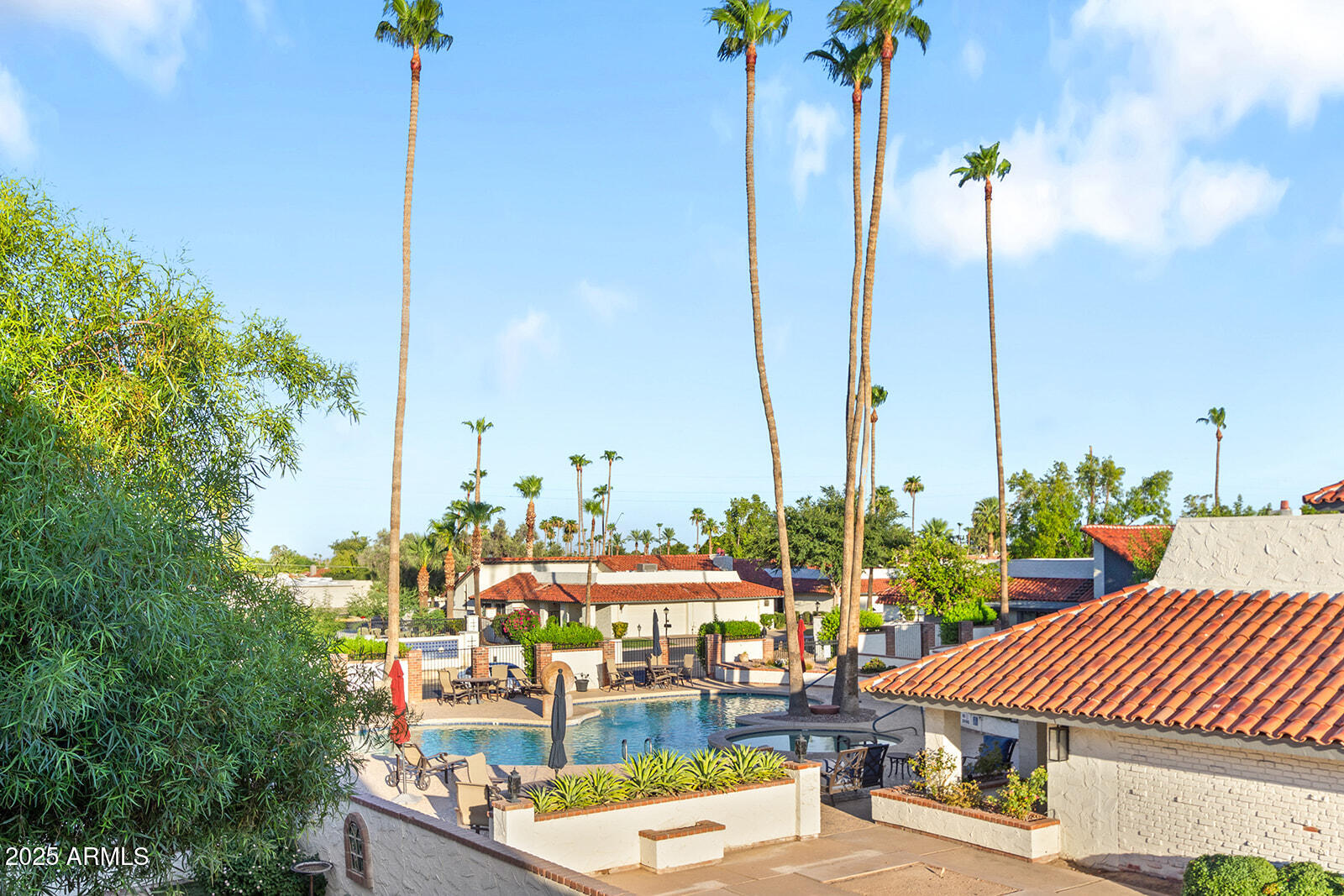 5822 North Scottsdale Road Paradise Valley, AZ 85253 - Photo 27 of 32 a view of a patio with a table chairs and a potted plants