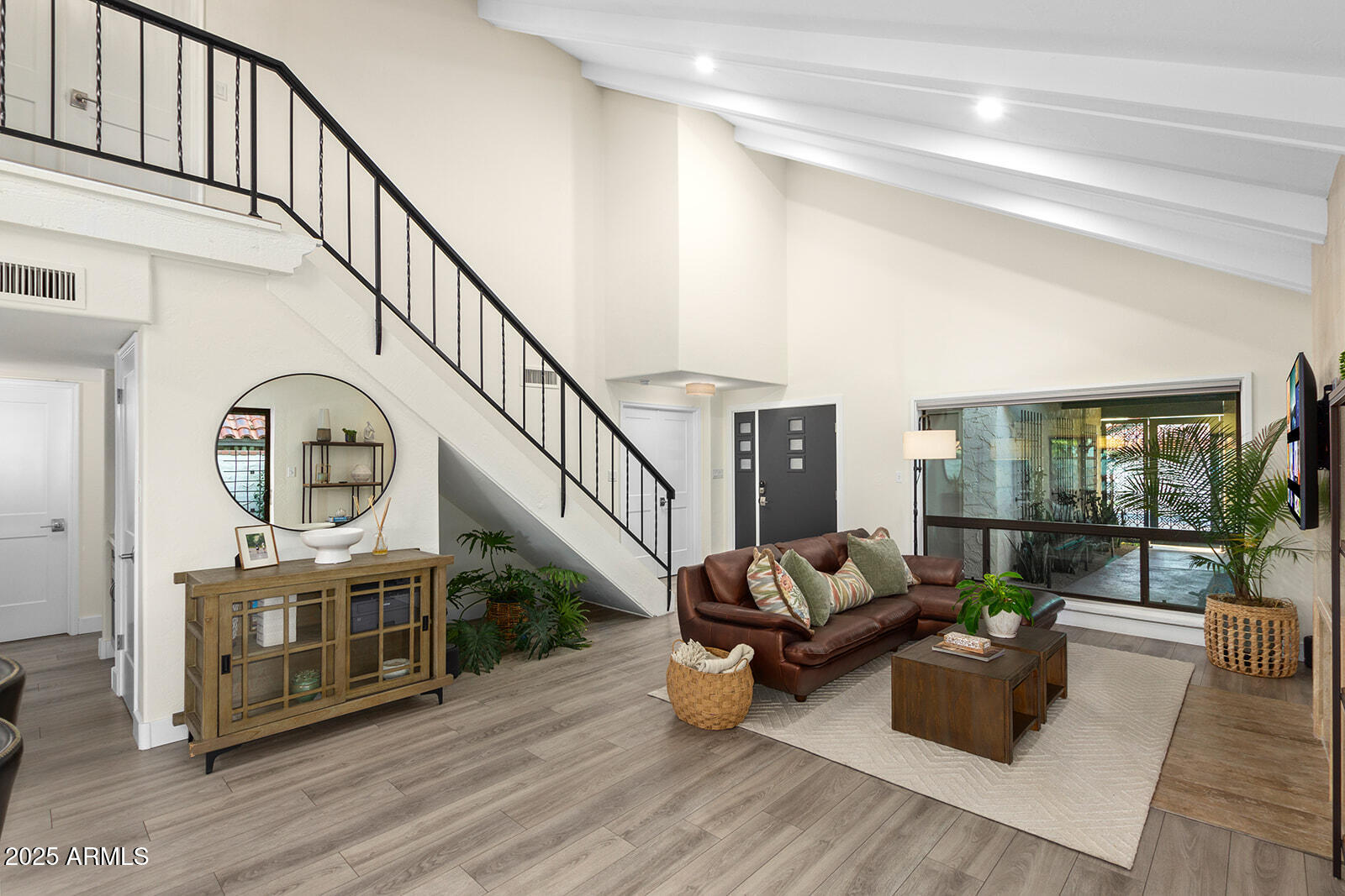 5822 North Scottsdale Road Paradise Valley, AZ 85253 - Photo 6 of 32 a living room with furniture and a wooden floor