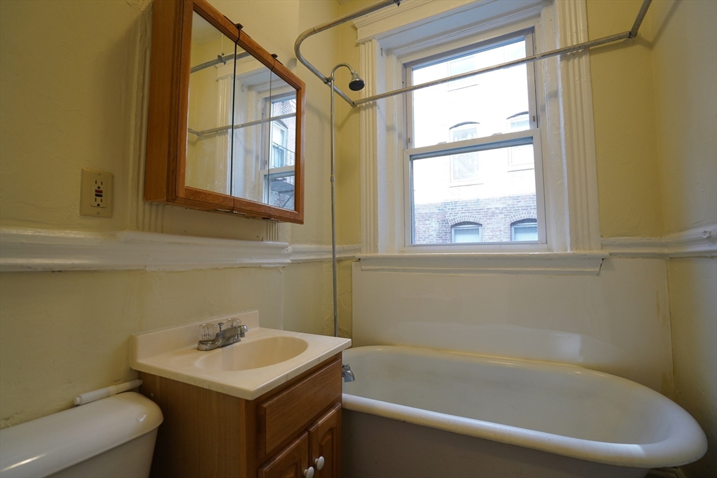 11 Royce Road, Unit 12 Boston, MA 02134 - Photo 7 of 7 a bathroom with a sink and a bathtub