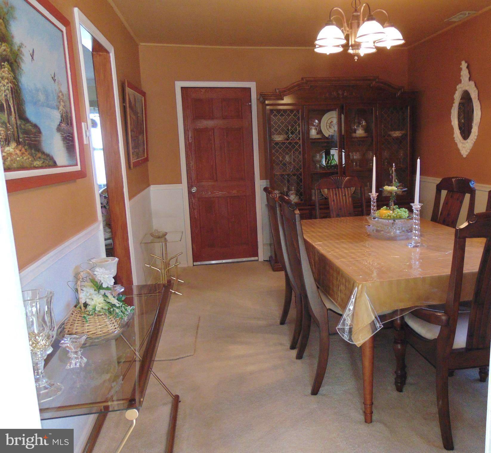 21 Cleft Rock Road Levittown, PA 19057 - Photo 34 of 54 Dining Rm w/ Door to front of Garage (storage)