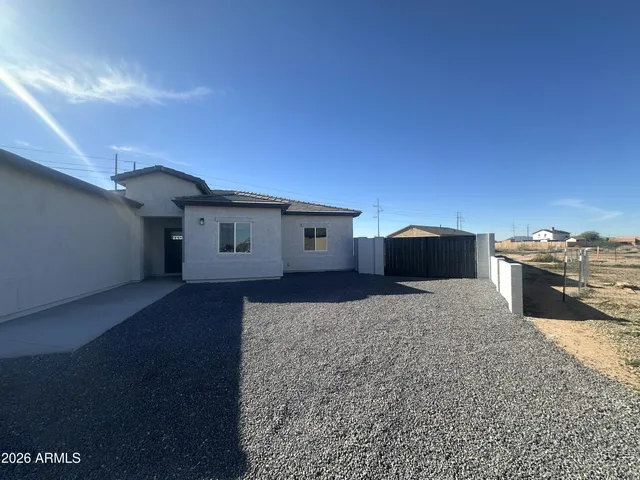 a large kitchen with a large counter top appliances and cabinets