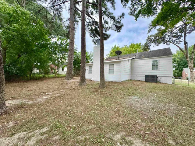 front view of a house with a trees