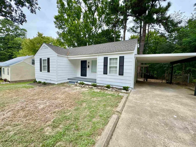 a house with trees in the background