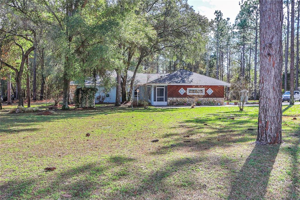 18012 Southwest 68th Loop Dunnellon, FL 34432 - Photo 1 of 60 a view of a house with a yard