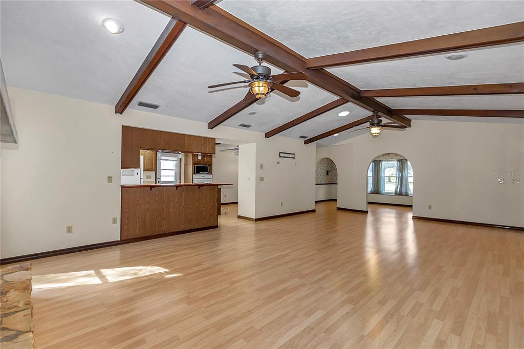 18012 Southwest 68th Loop Dunnellon, FL 34432 - Photo 13 of 60 a view of a livingroom with wooden floor and a ceiling fan