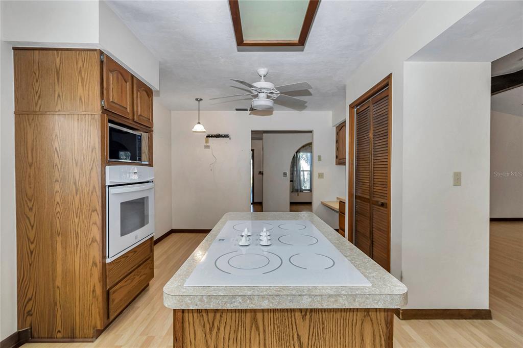 18012 Southwest 68th Loop Dunnellon, FL 34432 - Photo 18 of 60 a view of kitchen with sink microwave and refrigerator