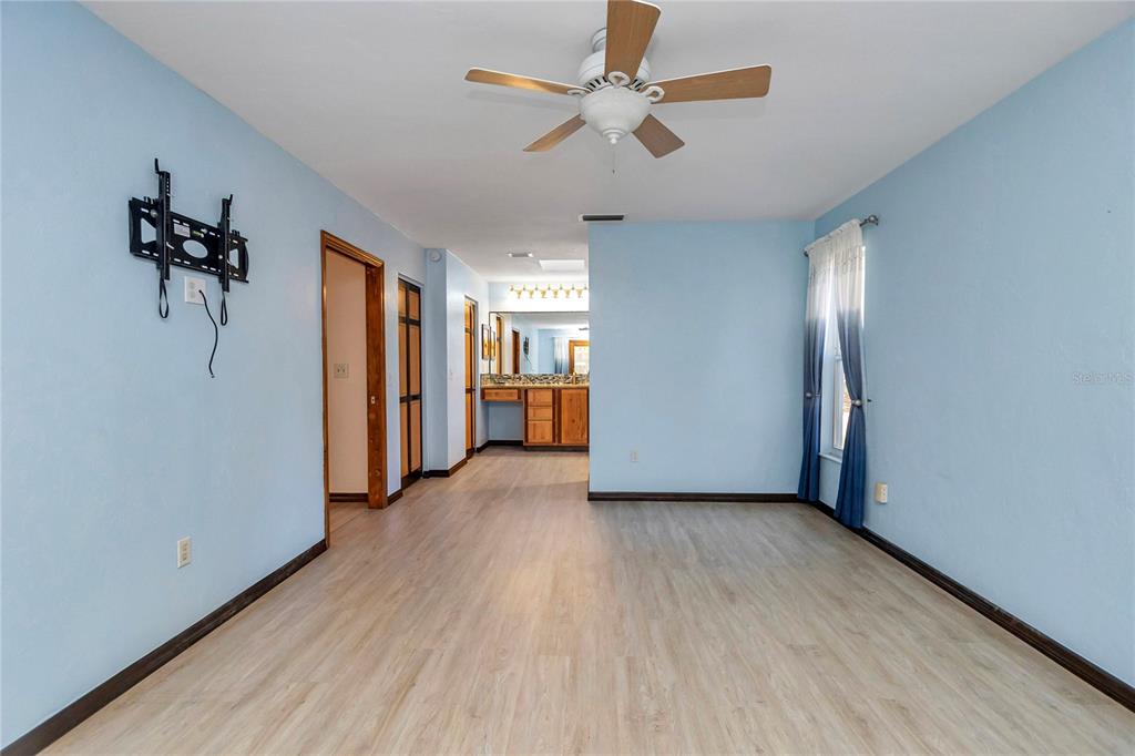 18012 Southwest 68th Loop Dunnellon, FL 34432 - Photo 23 of 60 wooden floor in an empty room with a window