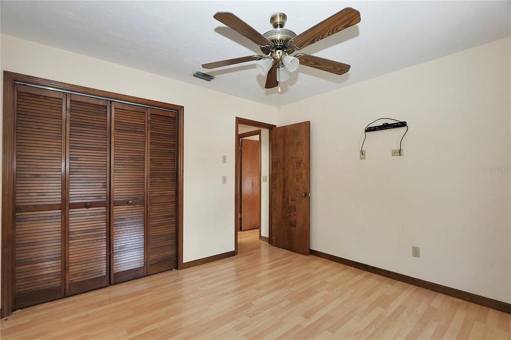 18012 Southwest 68th Loop Dunnellon, FL 34432 - Photo 36 of 60 an empty room with wooden floor closet and windows