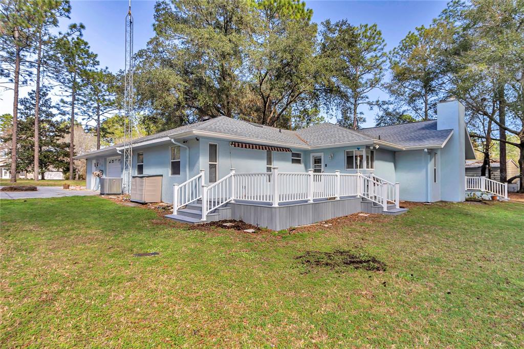 18012 Southwest 68th Loop Dunnellon, FL 34432 - Photo 45 of 60 a view of a house with a big yard plants and large trees