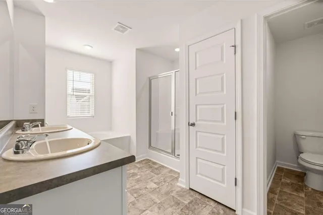 a bathroom with a sink a mirror and a bathtub