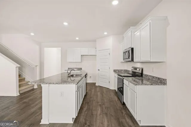 a view of cabinets and wooden floor