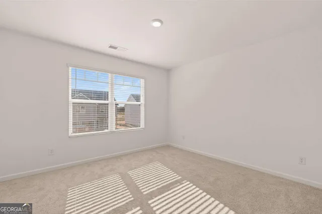 a view of a bathroom from the hallway