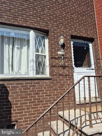 a brick building with a glass door
