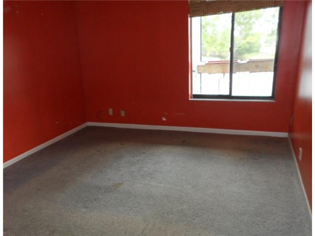 9920 Northwest 68th Place, Unit 210 Tamarac, FL 33321 - Photo 8 of 12 an empty room with a window