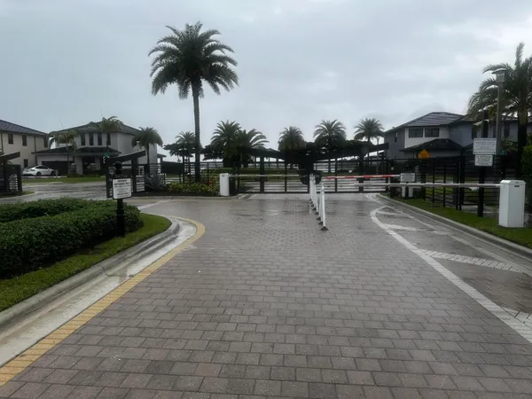 a swimming pool with outdoor seating and garden