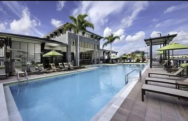 a view of a swimming pool with a patio