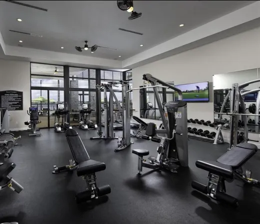 a large swimming pool with a large window and painted walls