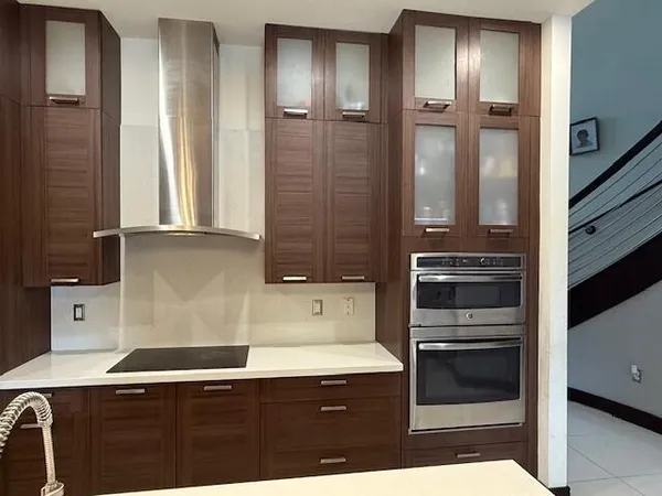 a kitchen with a refrigerator and a sink