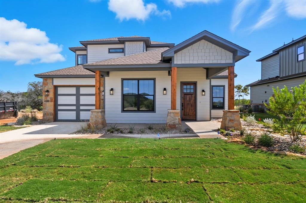 2050 Vista View Graford, TX 76449 - Photo 21 of 35 View of front of property featuring a shingled roof, a porch, a front yard, and concrete driveway
